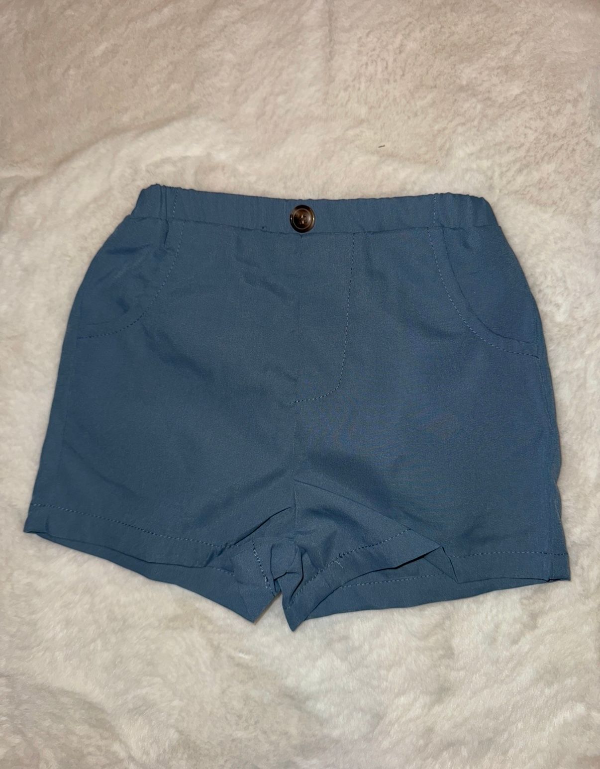 Navy blue casual shorts with button closure photographed on white background.