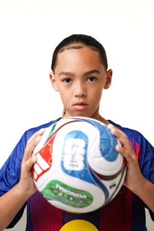 Close-up sequence showing hands holding and rotating a white soccer ball with colorful markings.