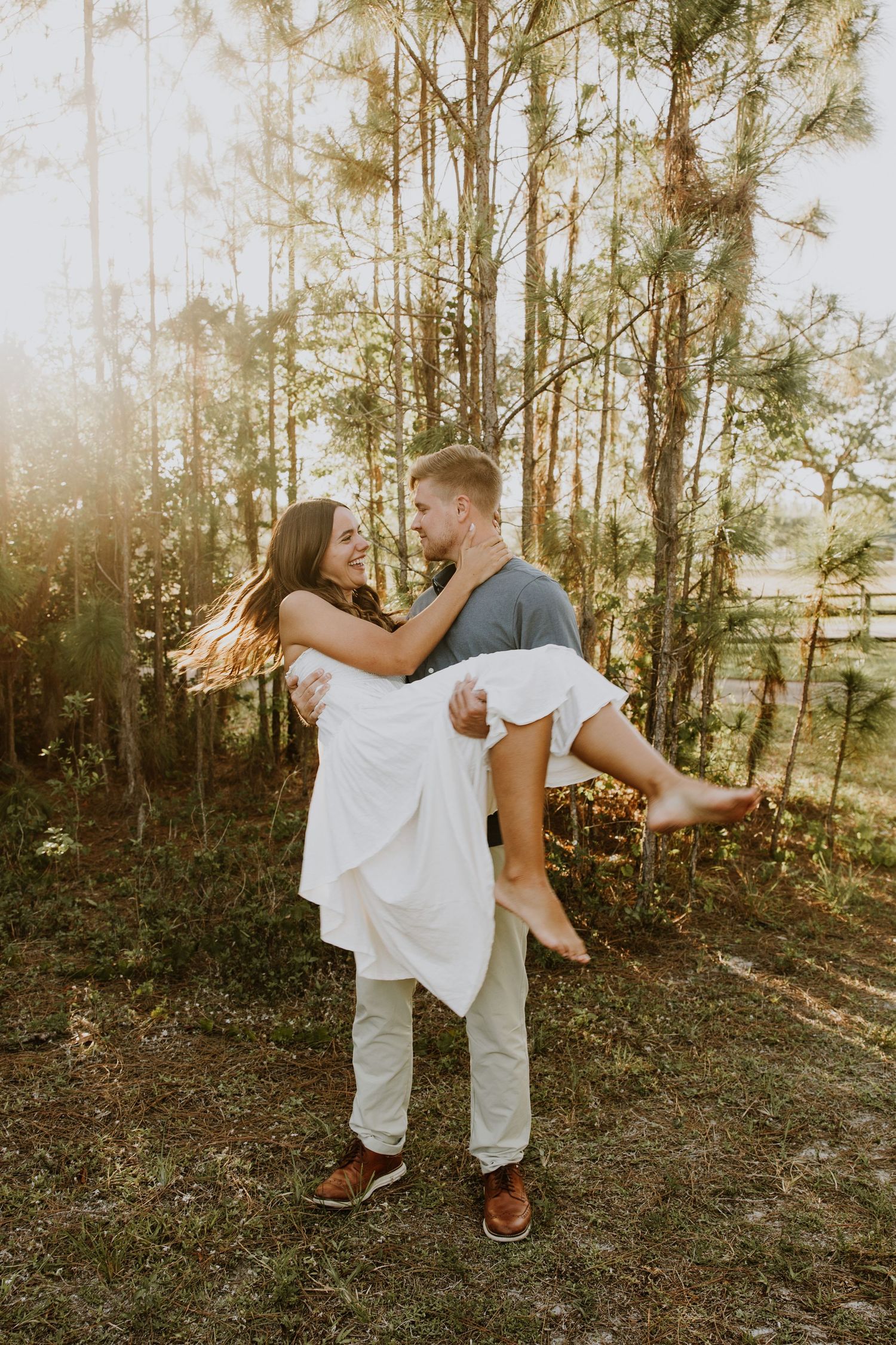 Golden hour Engagement photos captured by Lindsay McDow Photography in the greenery of a nature trail in West Palm Beach, Florida