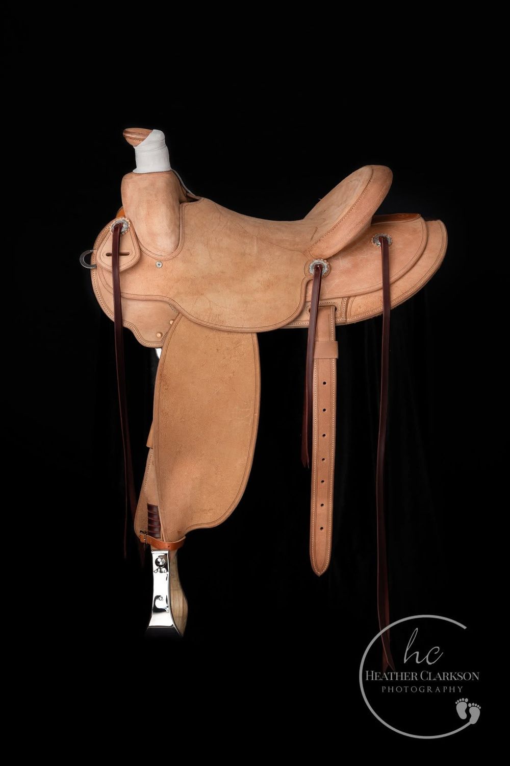Seven photographs of a tan leather Western saddle shown from different angles on a black background with white text detail.