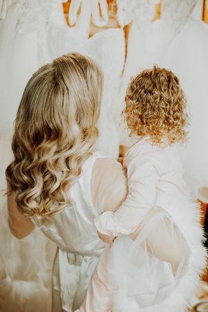 A series of intimate wedding photos showing curly blonde hair and white dress details.