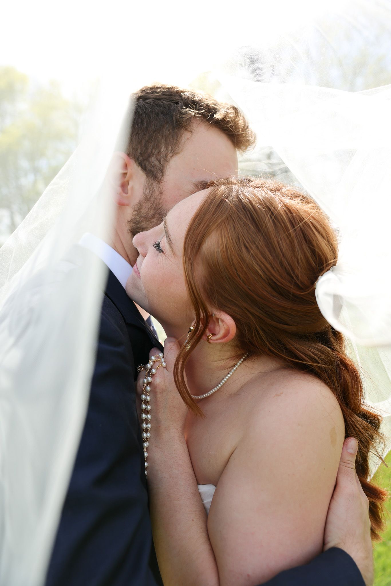 Romantic wedding kiss sequence captured in intimate close-up shots.