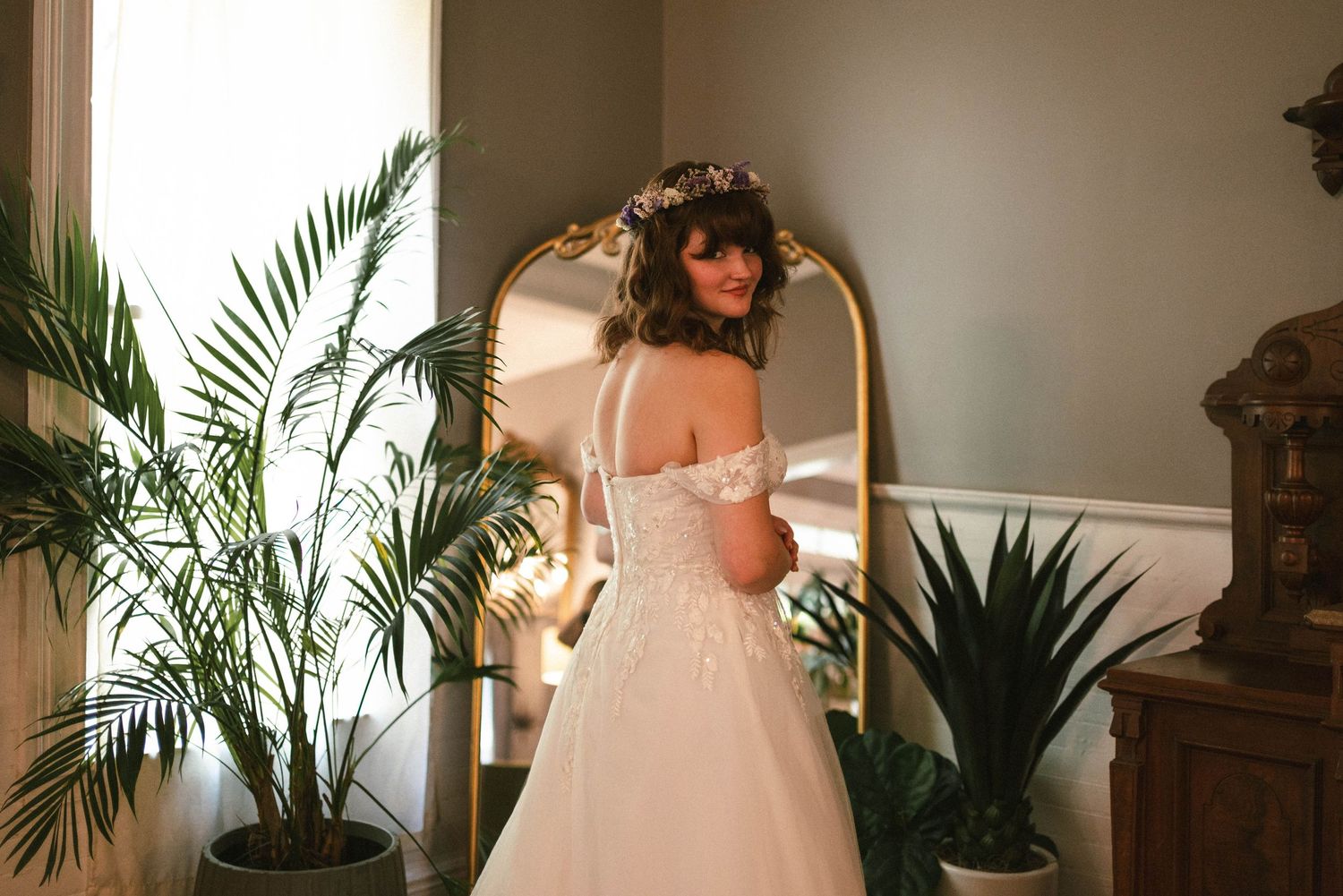 bride posing in front of miror