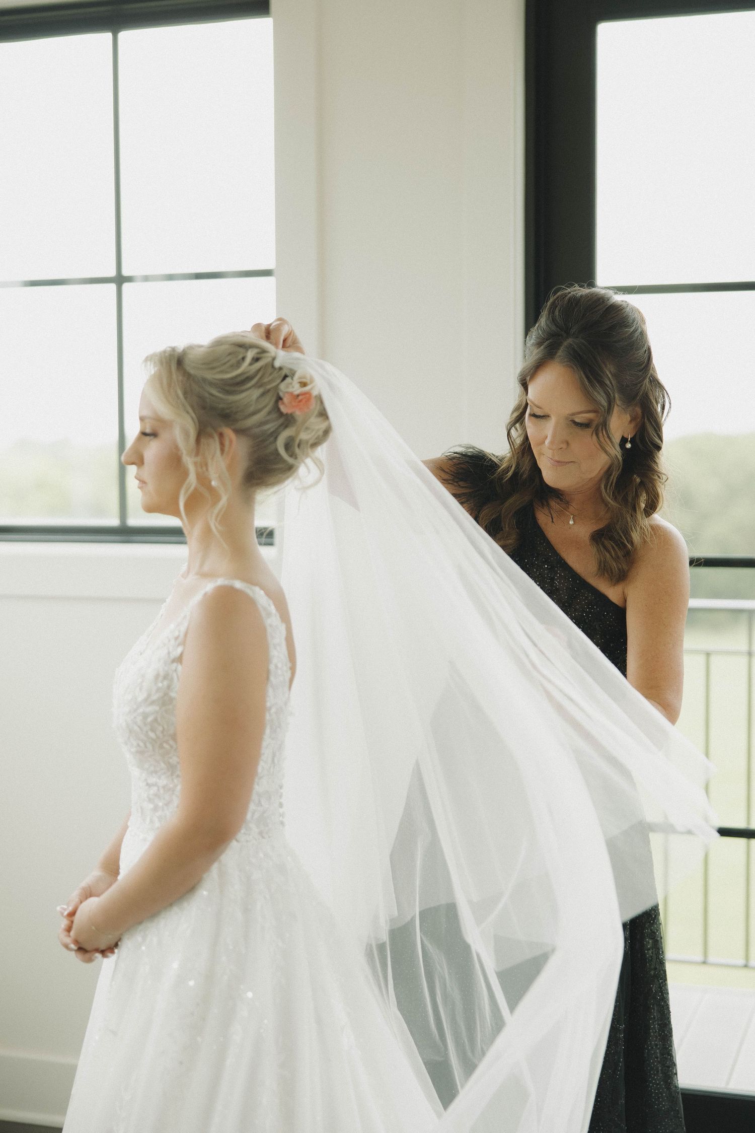 A series of five wedding preparation photos showing a bride in a white dress being helped with her veil.