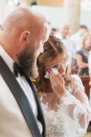 Emotional sequence of wedding photos showing close-up of a couple during a touching moment at their ceremony.