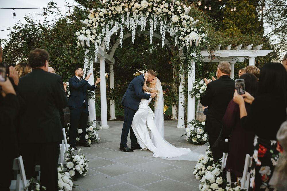 Bride and groom kiss after ceremony at Long Island wedding