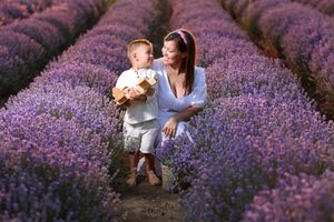 Family portraits captured in stunning rows of purple lavender flowers under summer skies.