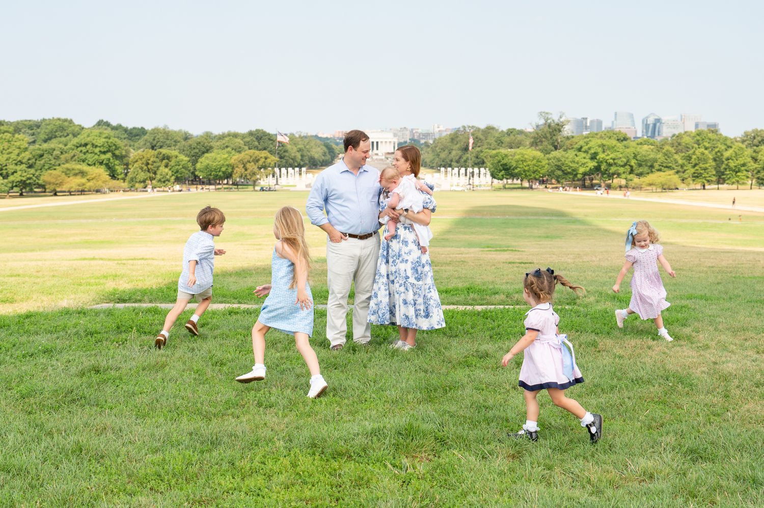 Authentic moment between parents captured during a relaxed outdoor family photo session in Washington, DC.