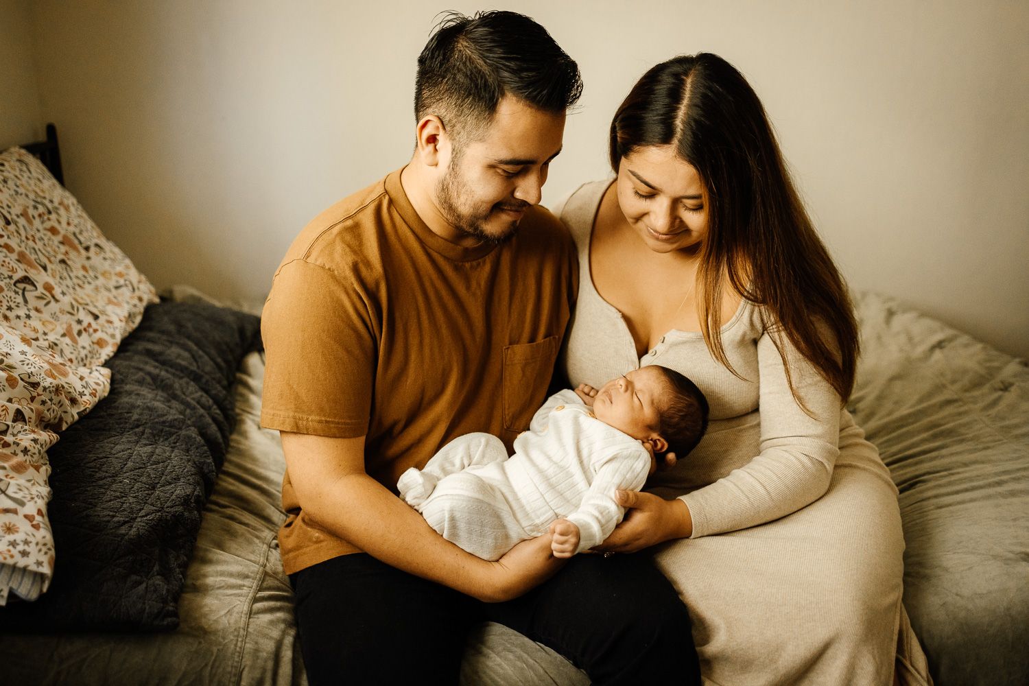 parents cuddle new baby at newborn photoshoot with Bay Area Newborn Photographer Cindy Tucey in Campbell