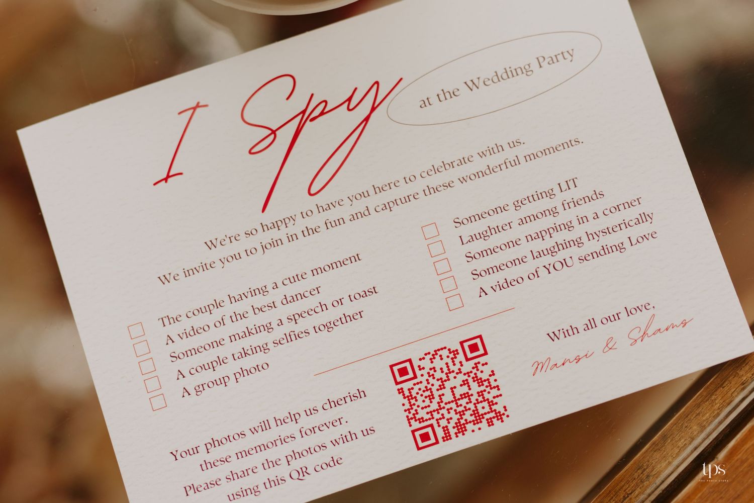 Wedding game card titled 'I Spy' with instructions and QR code in red and black text.