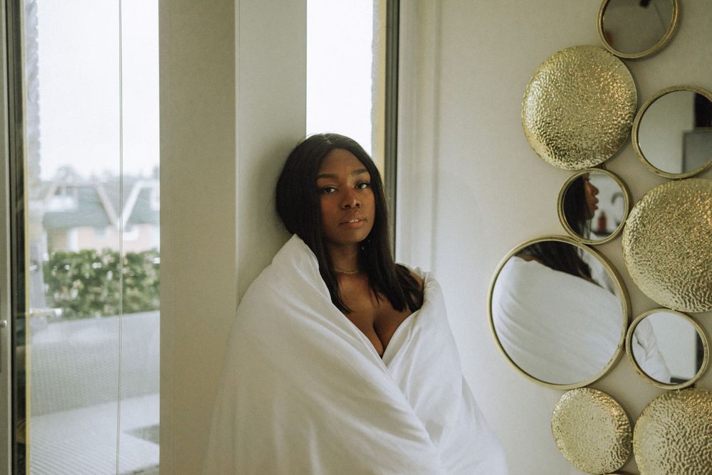 Minimalist interior shots with decorative circular mirrors on white walls.