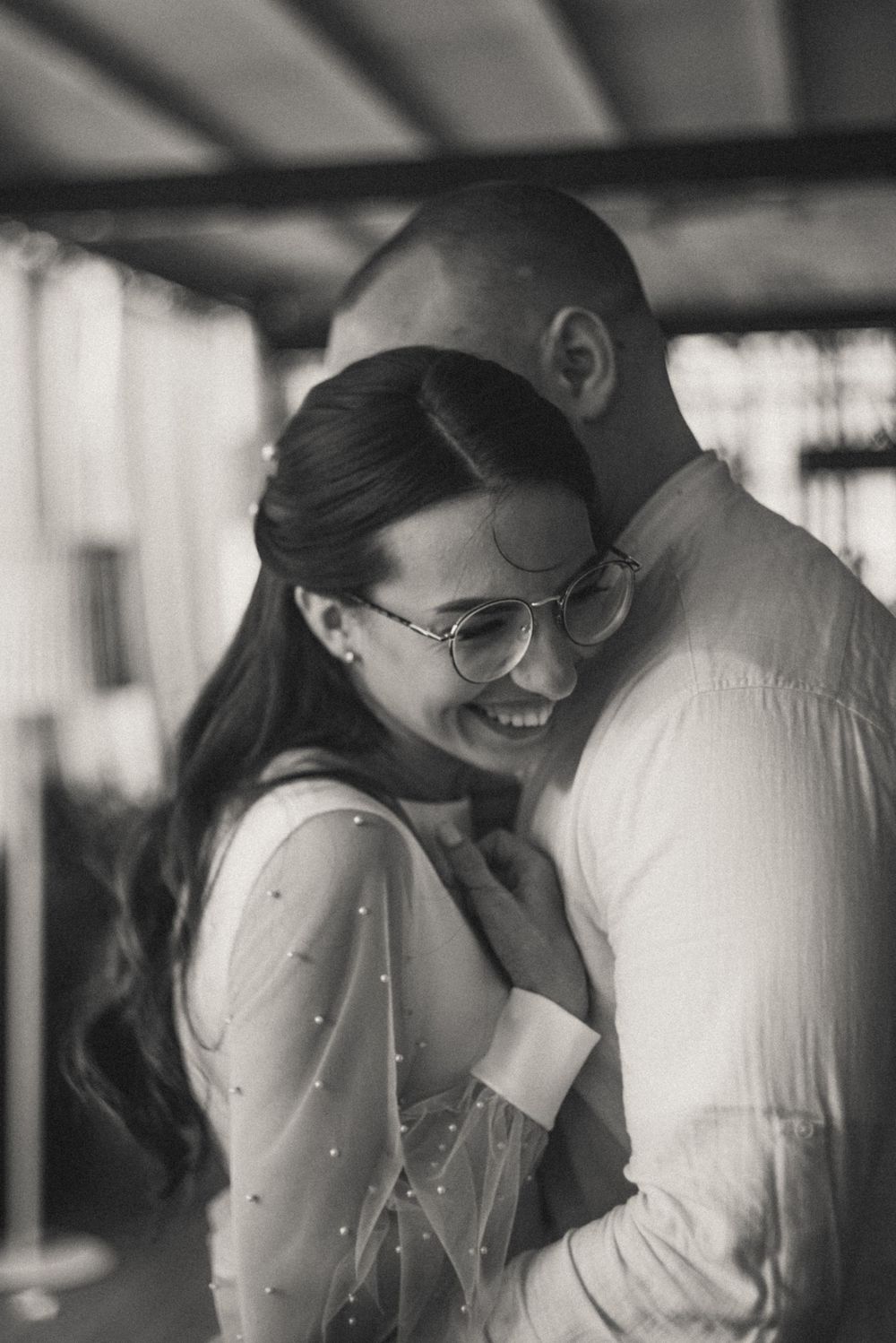Black and white intimate portrait capturing a tender moment between a couple.