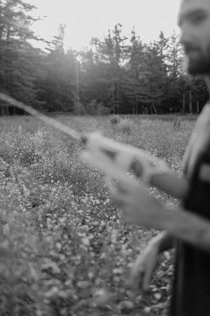 Artistic black and white capture of movement in a wildflower meadow.