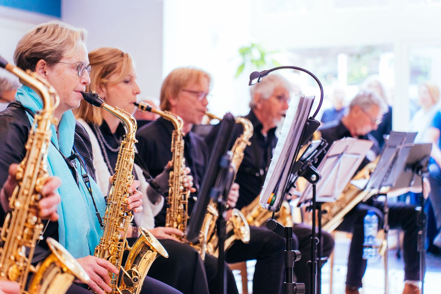 Six musicians (including saxophonists) performing at a formal corporate event or reception. Big Band Festival Venlo Vivitu Jazz