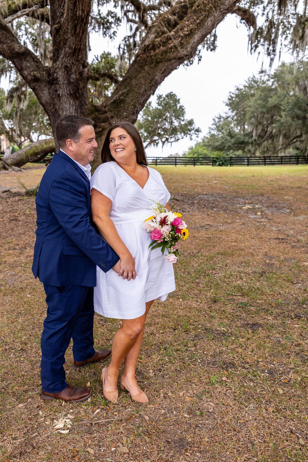 Casual wedding portraits captured in a natural outdoor setting.