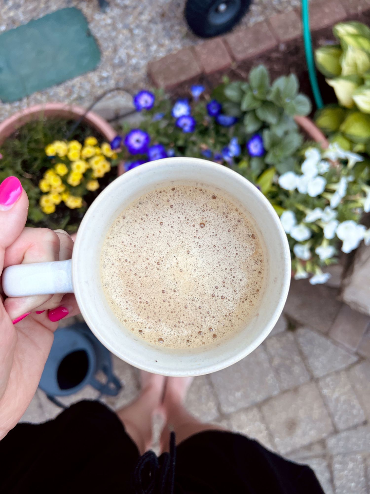 Mom holding coffee in her garden - lifestyle family photographer in South Lyon, Michigan.