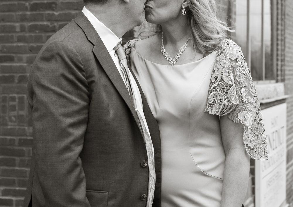 man and woman posed for their wedding