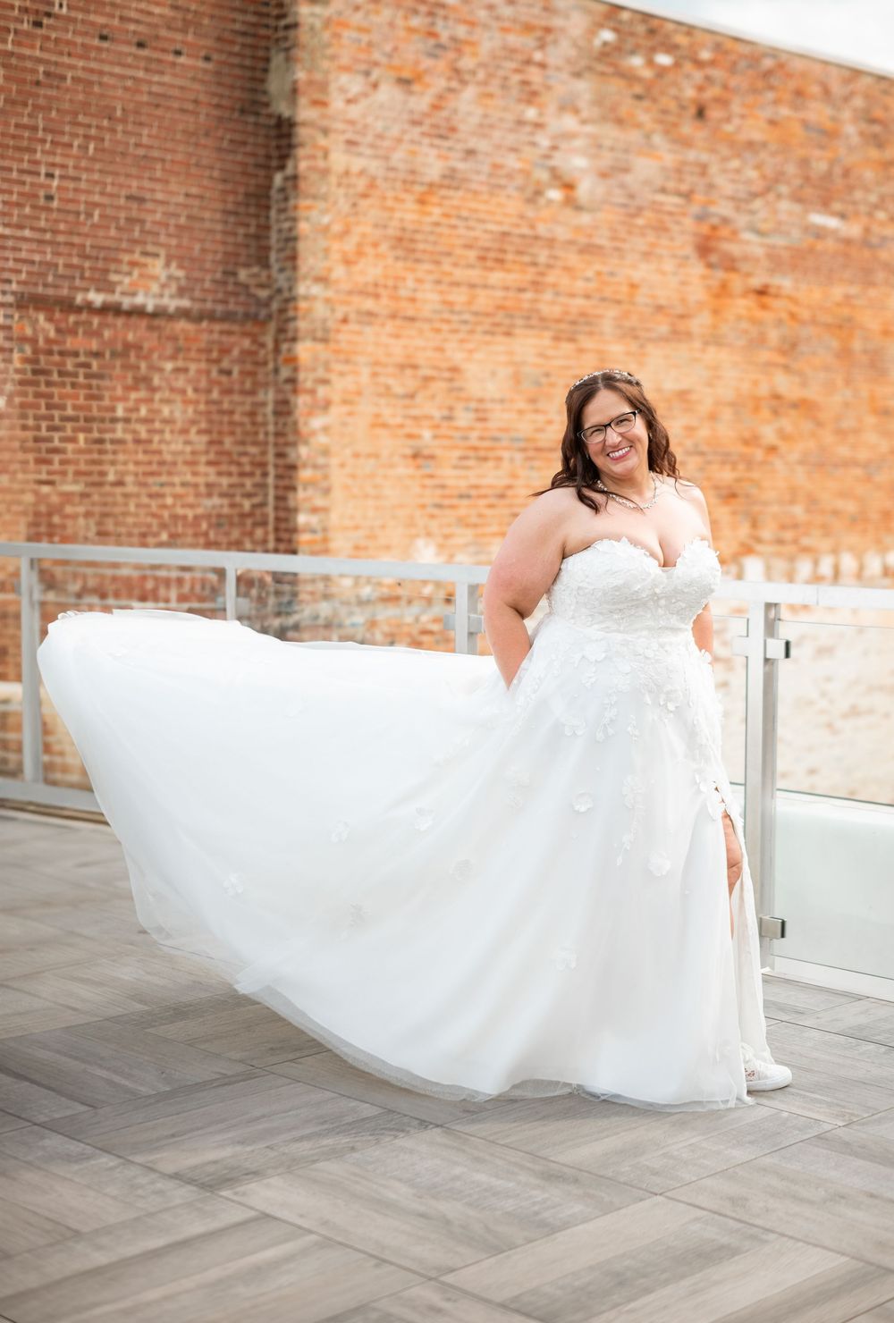 woman posing wedding dress rooftop