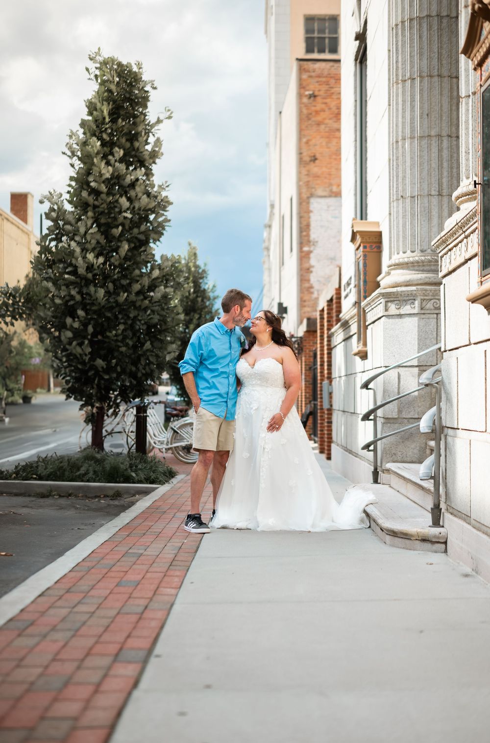 couple posing downtown wedding
