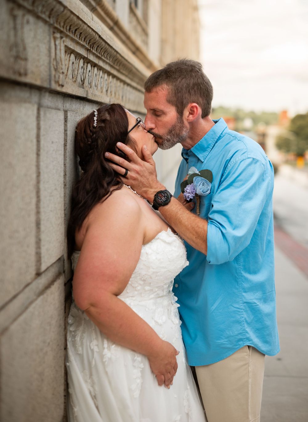 couple posing downtown wedding
