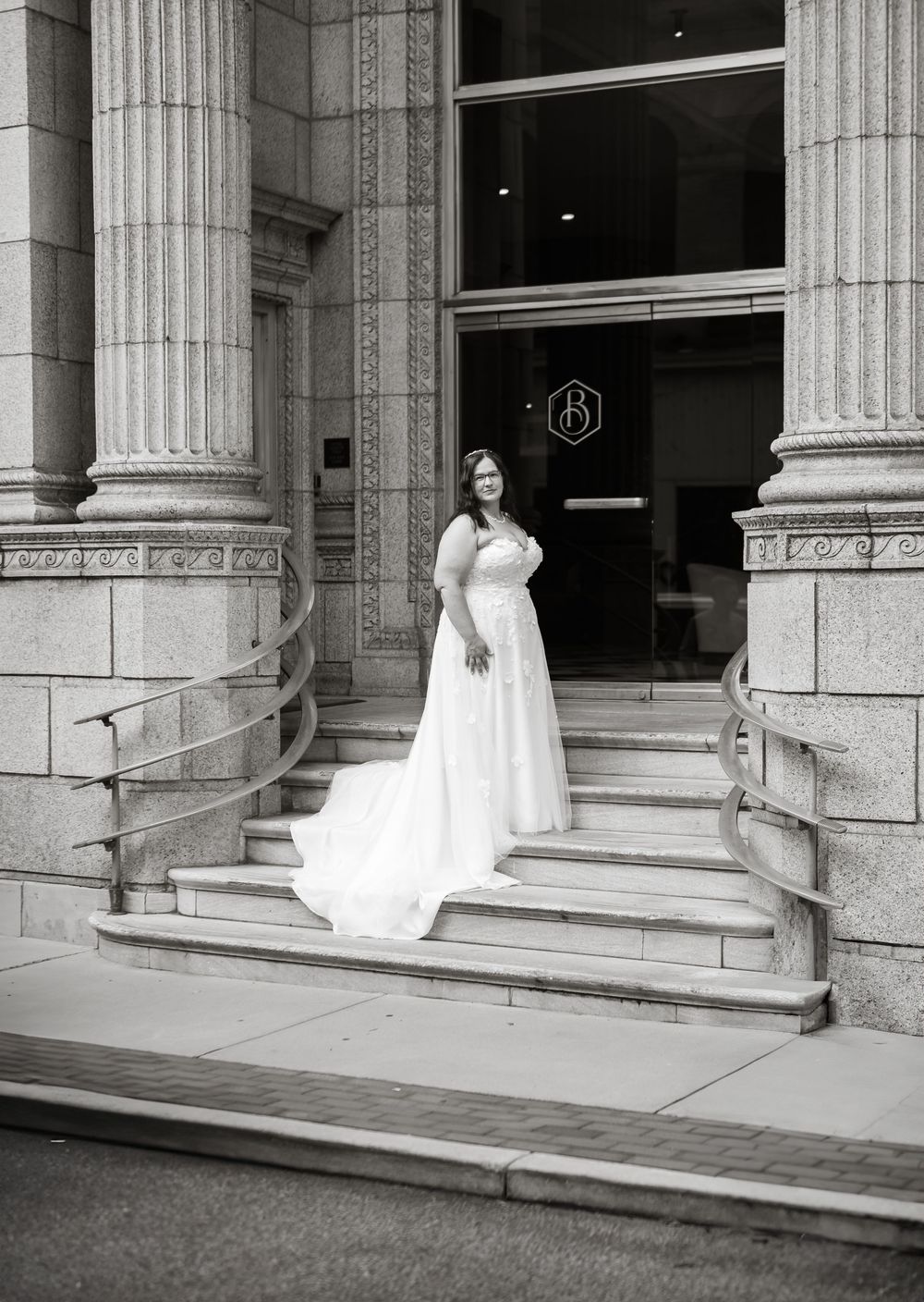 woman posing on steps downtown