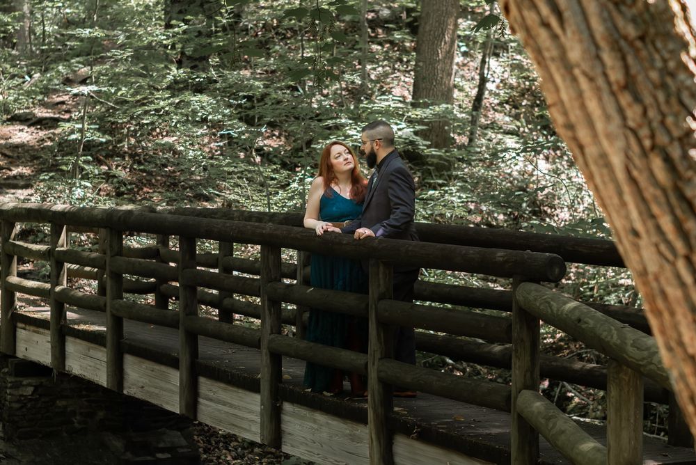 couple posing on bridge