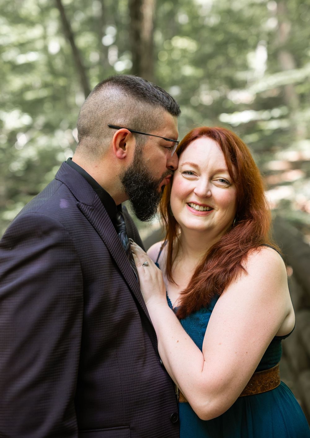 couple posing in woods