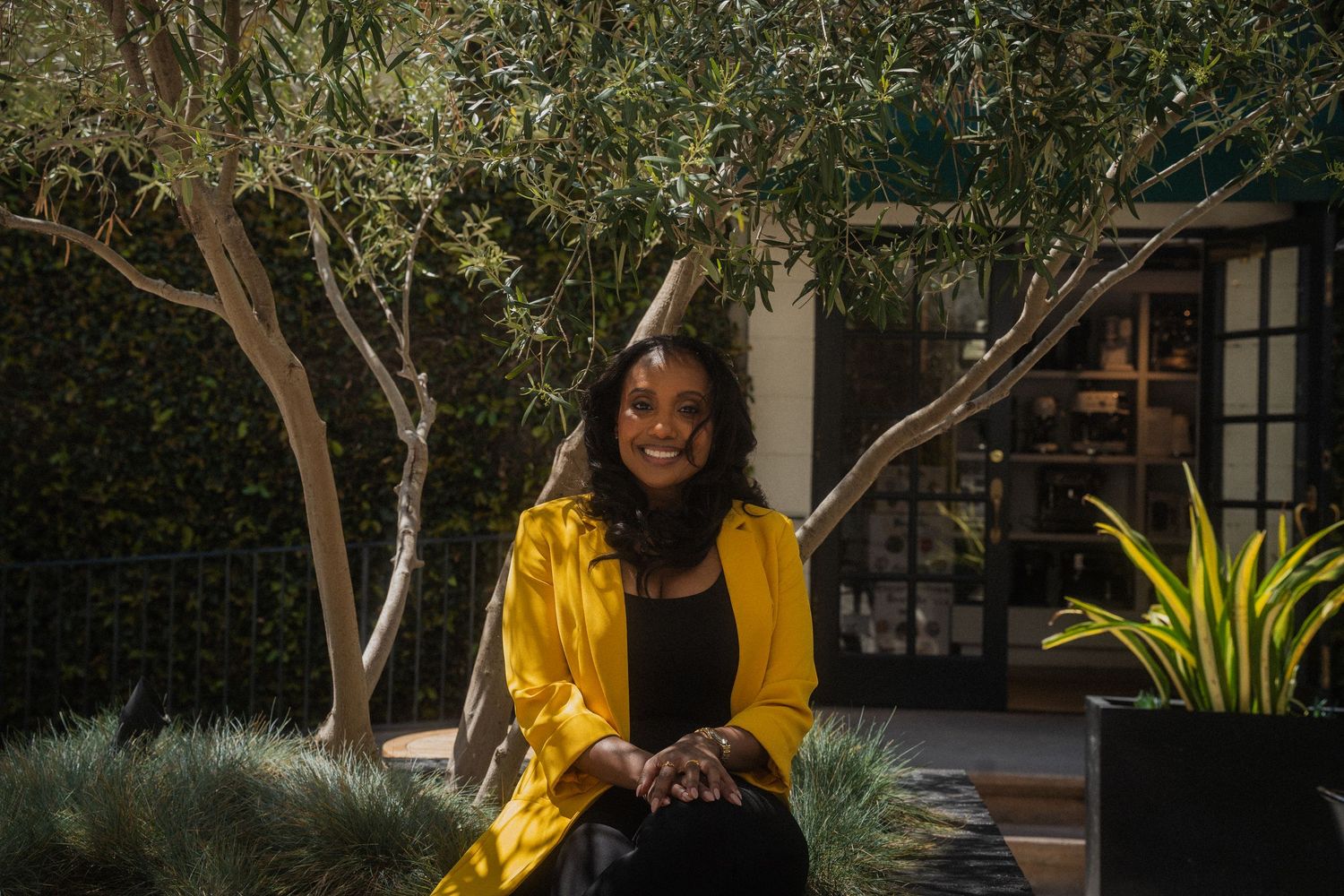Outdoor headshot in Pasadena with natural lighting and a relaxed, genuine smile