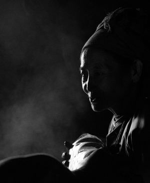 Dramatic black and white profile shots in low-key lighting.