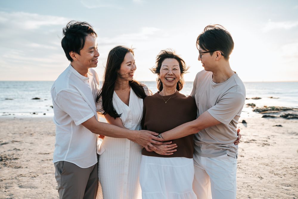 A family portrait by the beach taken by a Melbourne family photographer.