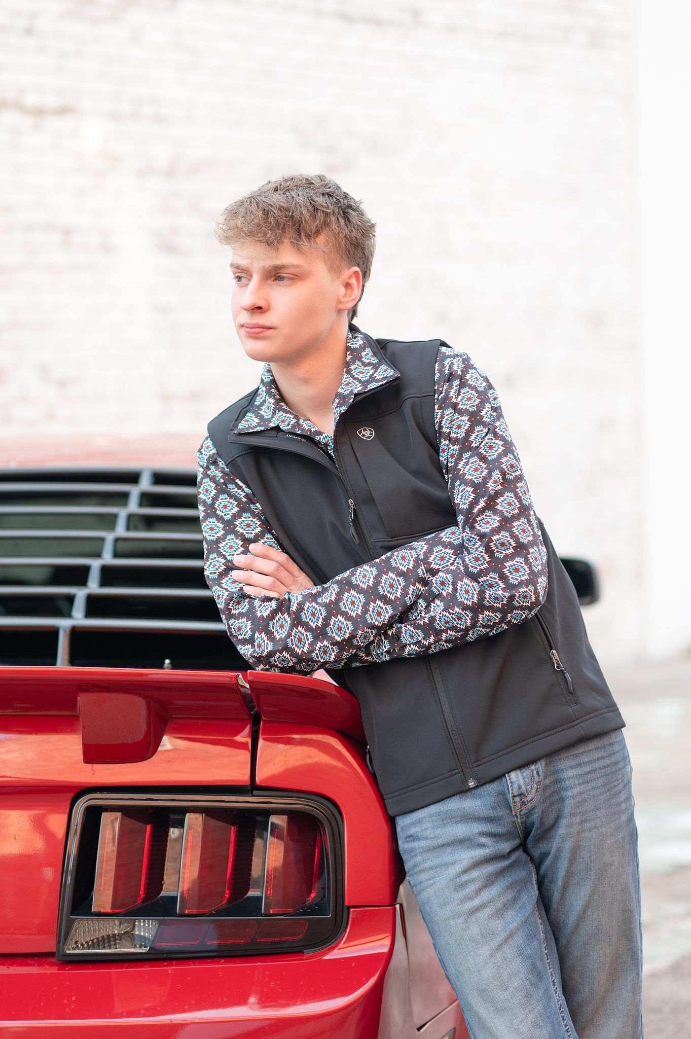Senior Guy with Red Sports Car in Downtown Bartlesville and Field by Bartlesville Photographer Kristi Bray