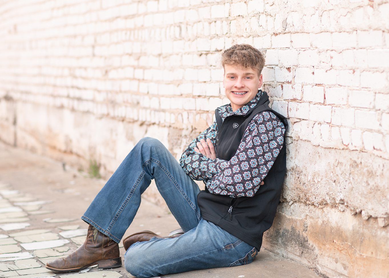 Senior Guy with Red Sports Car in Downtown Bartlesville and Field by Bartlesville Photographer Kristi Bray