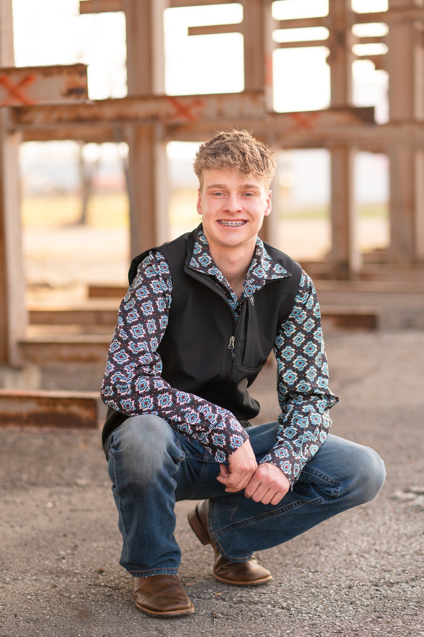 Senior Guy with Red Sports Car in Downtown Bartlesville and Field by Bartlesville Photographer Kristi Bray