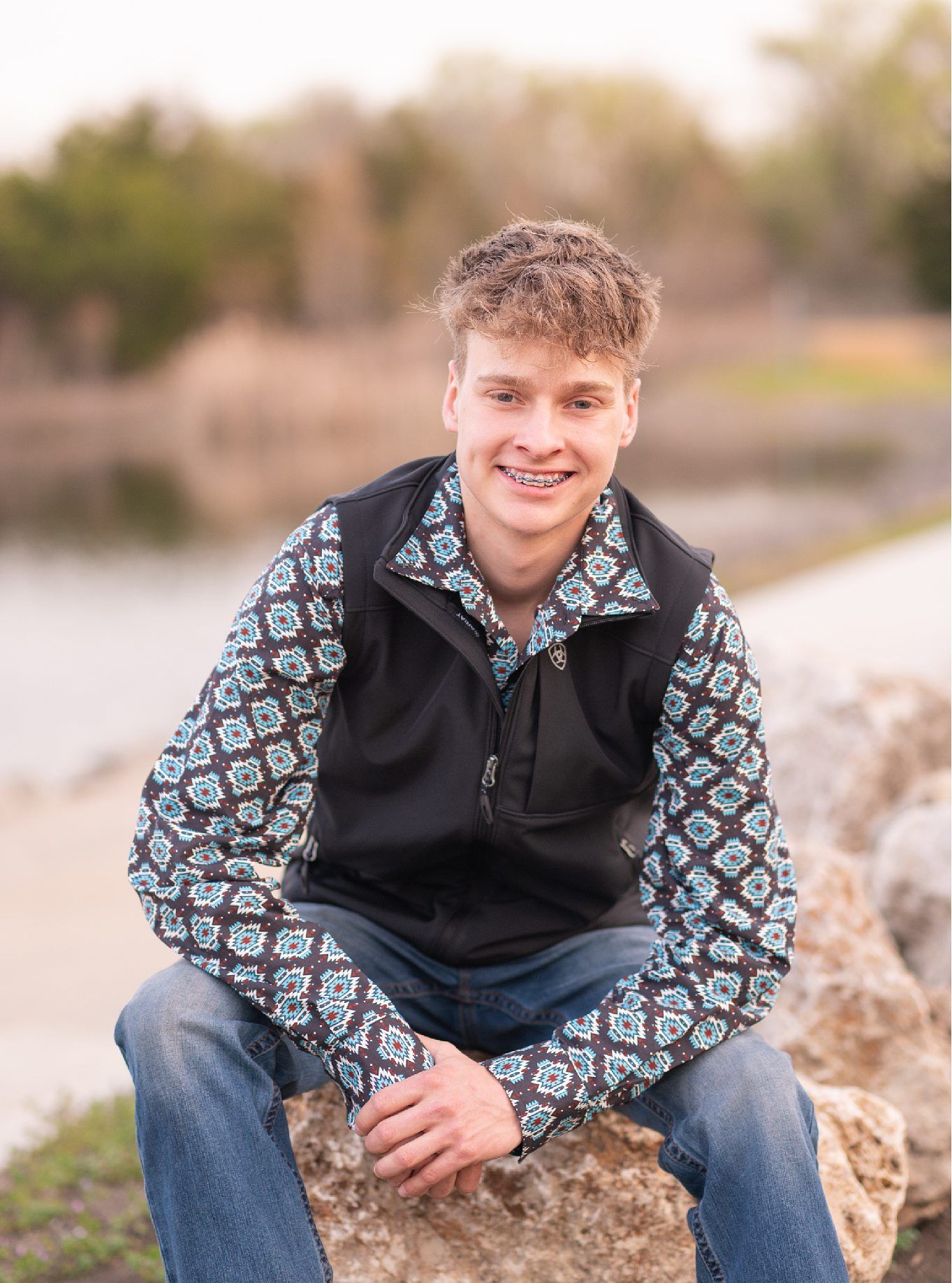 Senior Guy with Red Sports Car in Downtown Bartlesville and Field by Bartlesville Photographer Kristi Bray