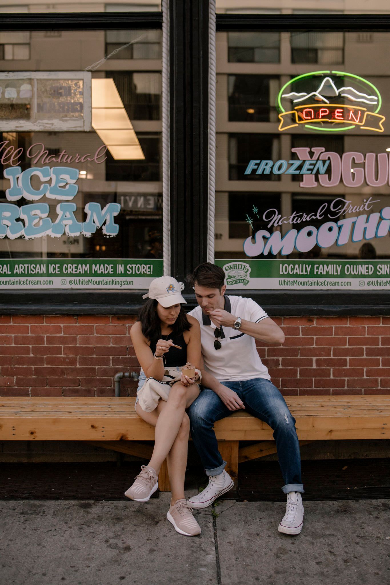 Couple enjoying artisan ice cream outside White Mountain in Kingston, a charming hidden-gem location for storytelling portrait sessions
