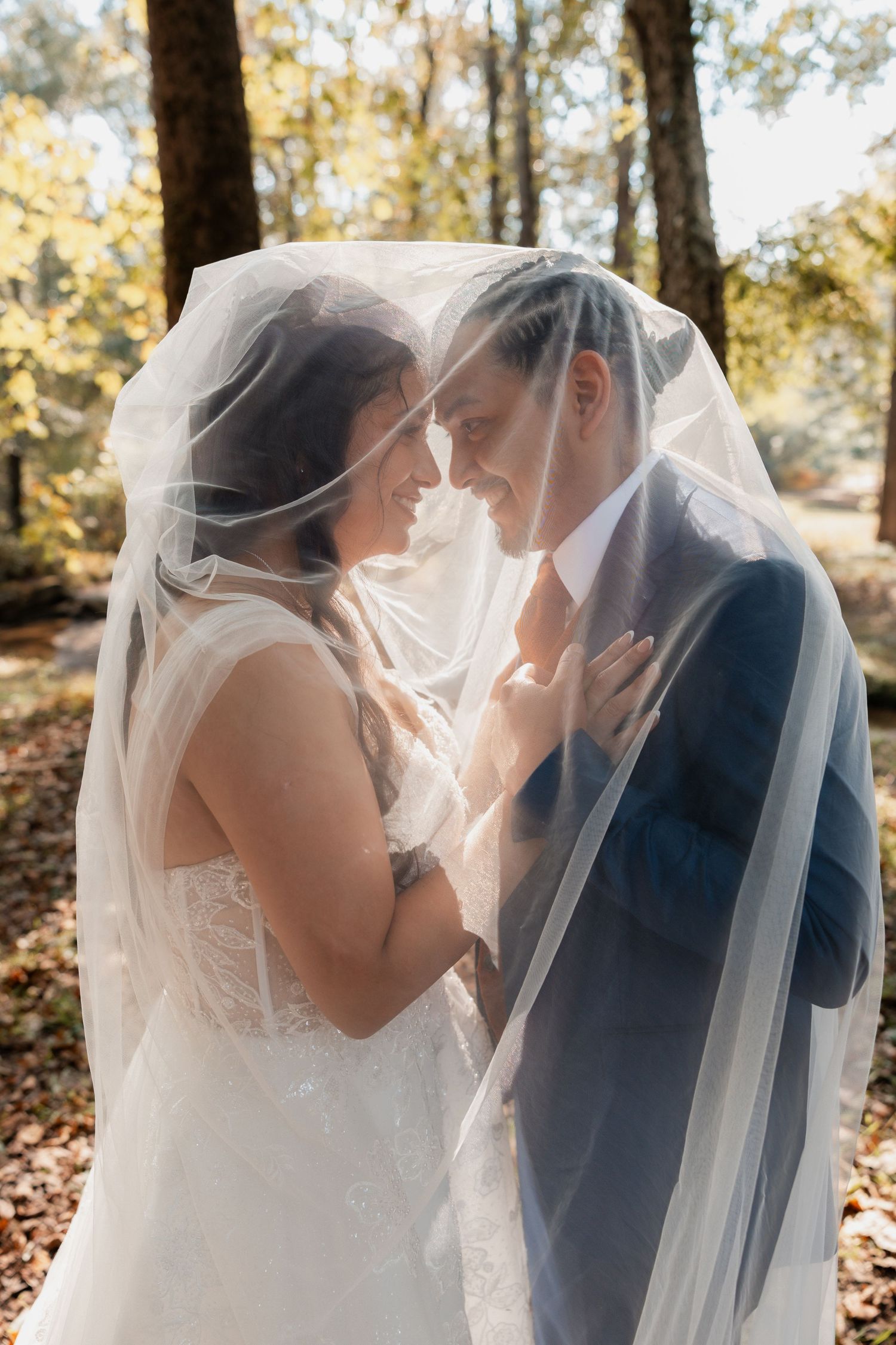 Elegant bride and groom posing together in formal wedding attire – classic Atlanta wedding portrait session.
