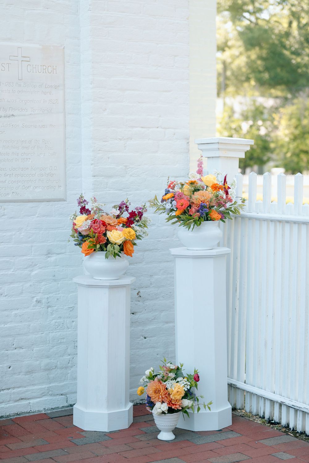 Floral arrangements outside of Old Christ Church for a wedding in Pensacola