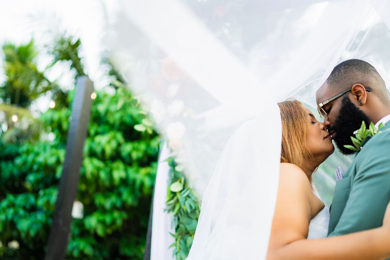 Intimate wedding portrait featuring luxury details and formal attire.