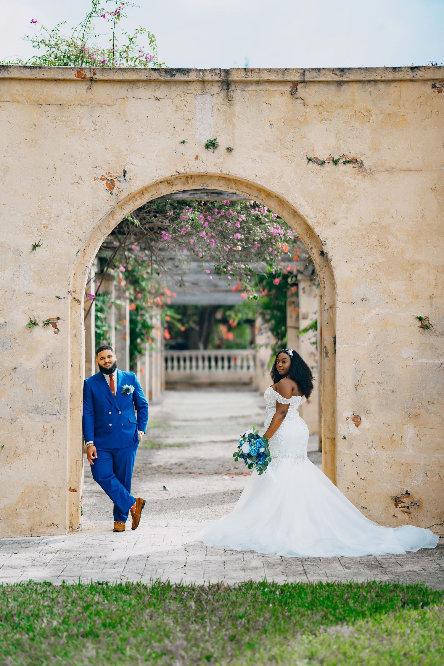 Intimate wedding portrait featuring luxury details and formal attire.