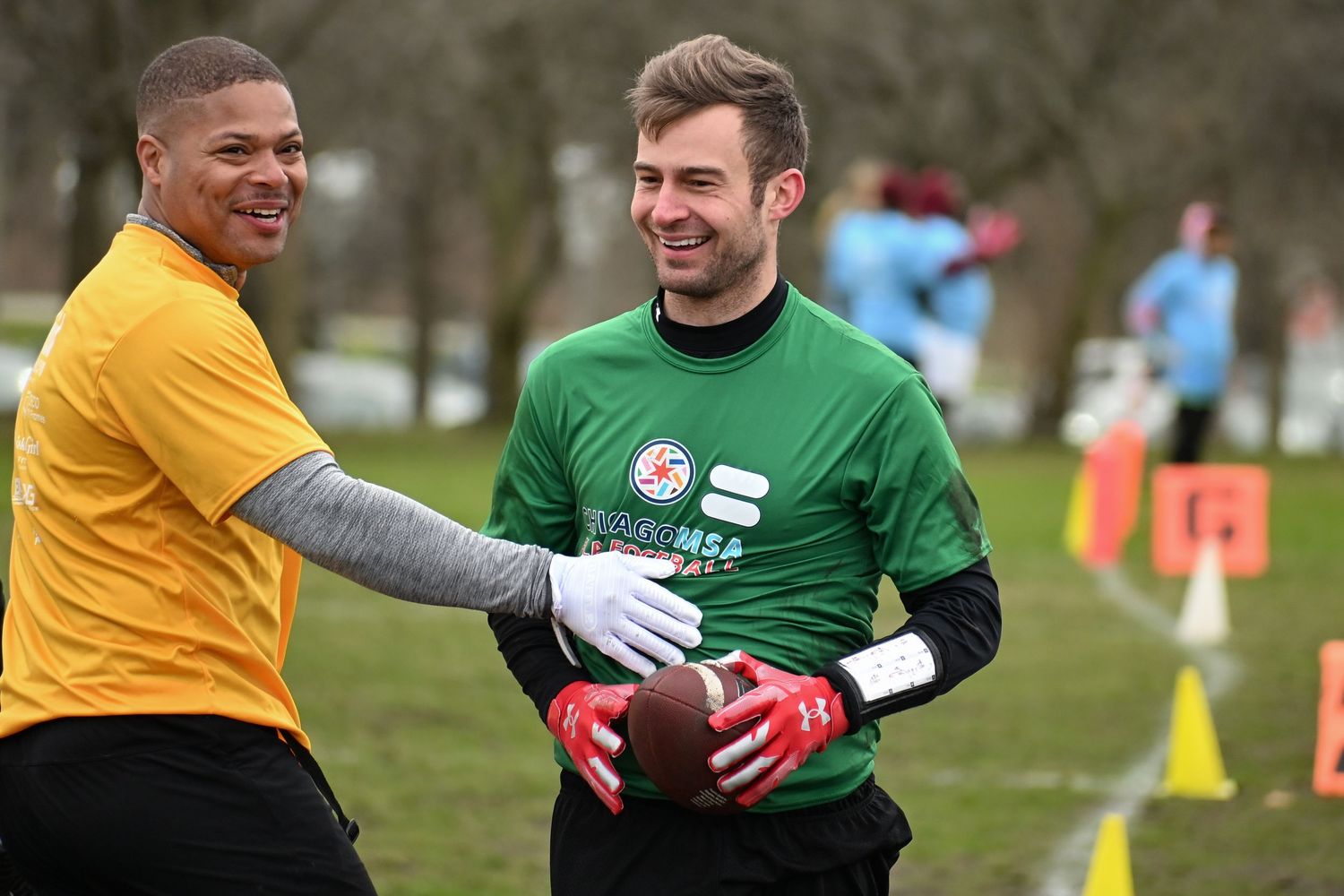 Two flag football players from CMSA smile after a great play in between downs at Cricket Hill in Chicago