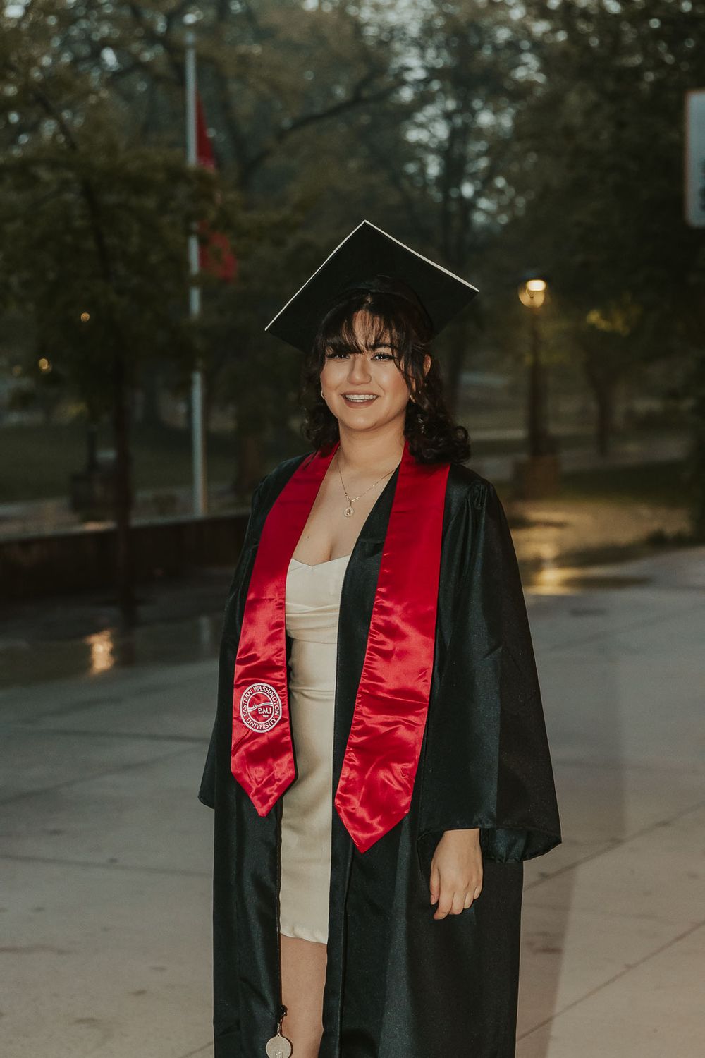 Eastern Washington University senior photos of Laura in cap and gown on the Cheney, WA campus.