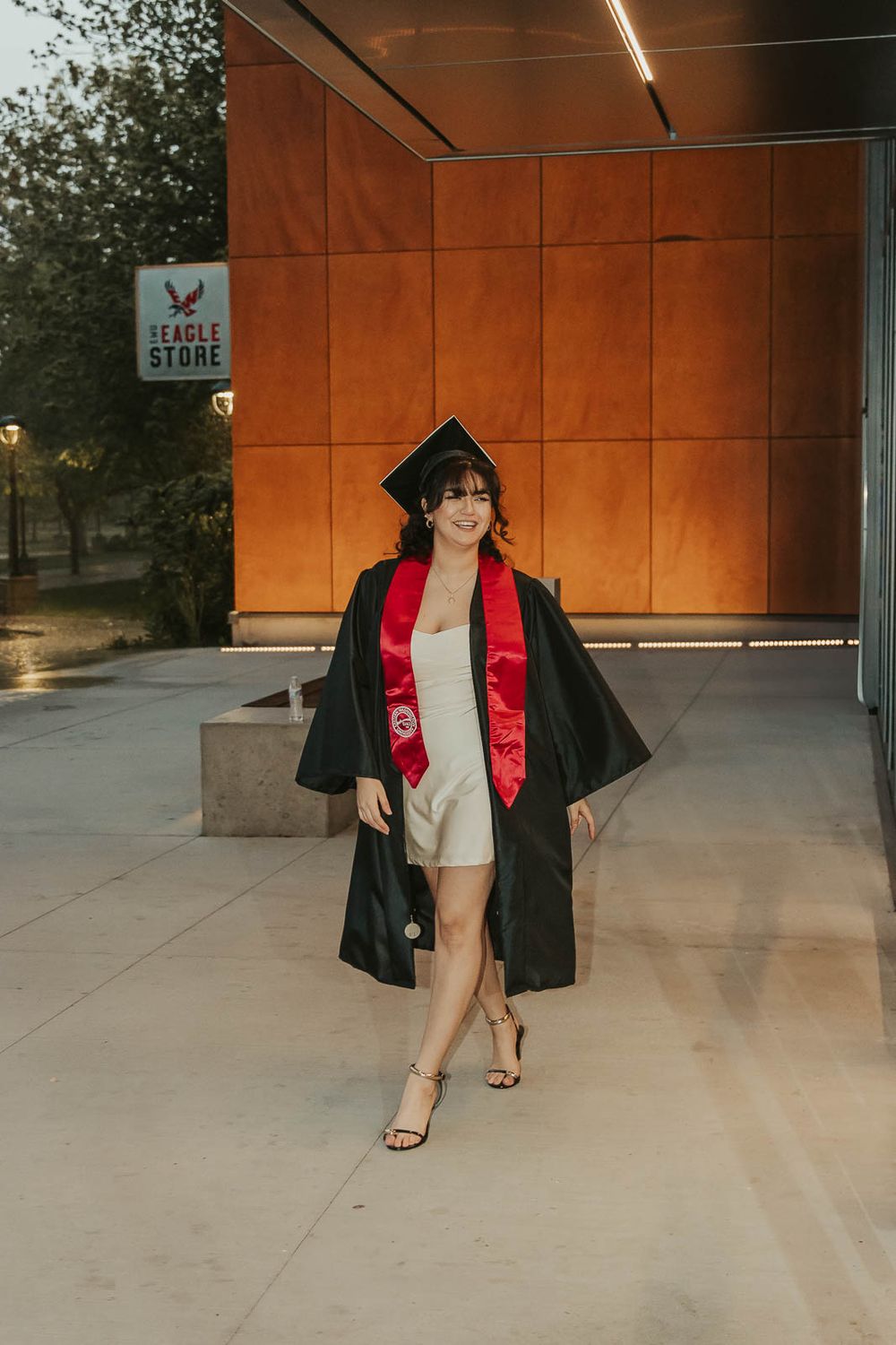 Eastern Washington University senior photos of Laura in cap and gown on the Cheney, WA campus.