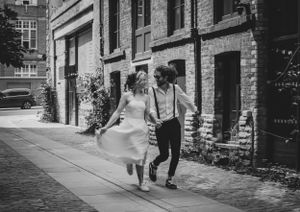non-traditional wedding photographer - running through the streets