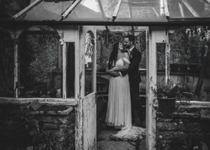 non-traditional wedding photographer in the Lake District - couple portrait in the green house