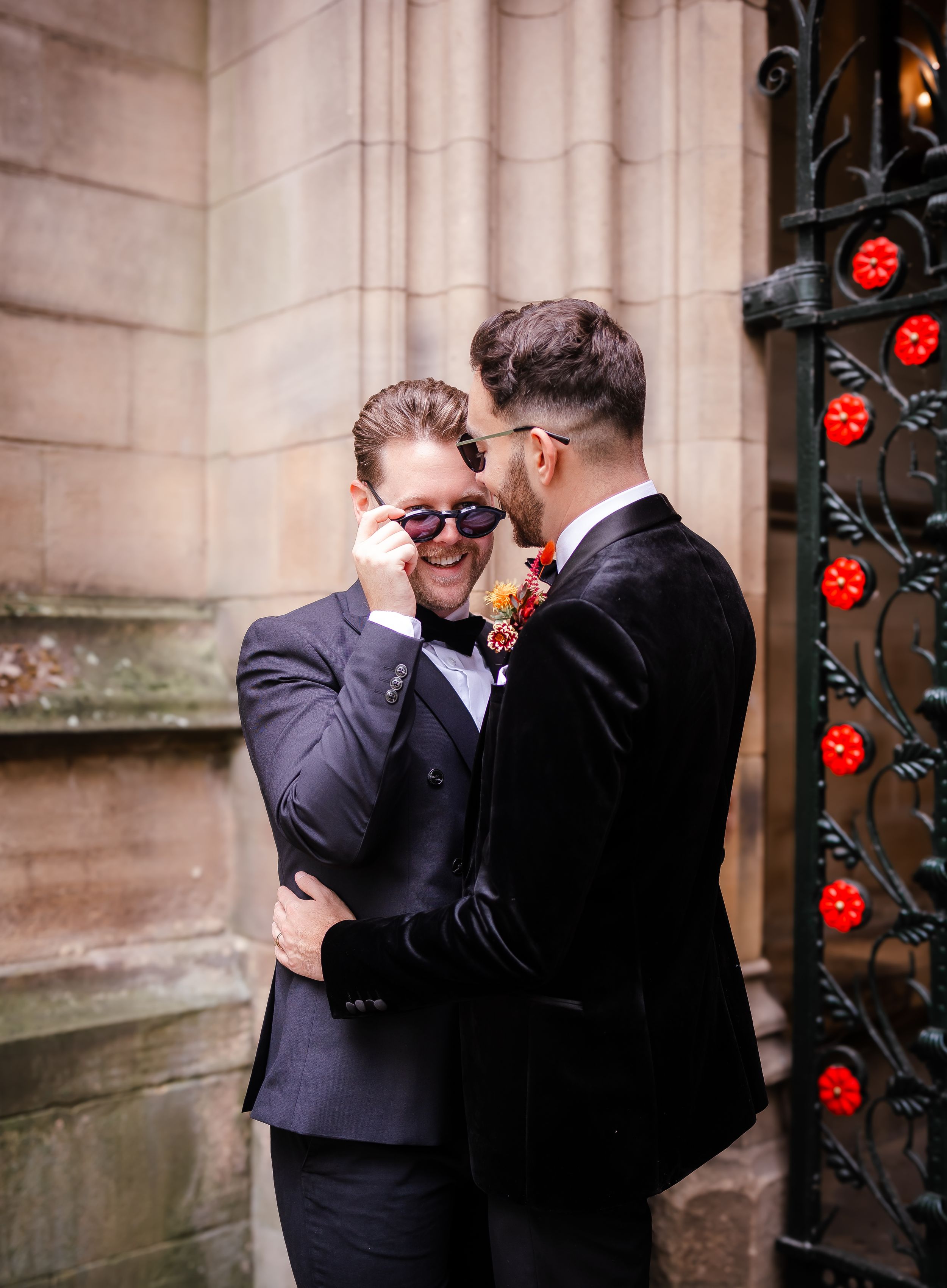 non-traditional wedding photographer groom peering over his glasses