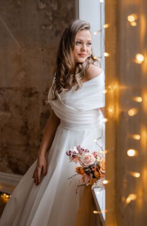 non-traditional wedding photographer in the Lake District - bride sitting in the window