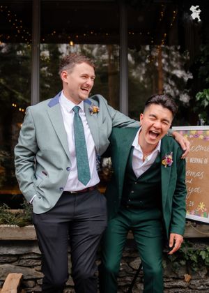 non-traditional wedding photographer in the Lake District - groom and best man laughing