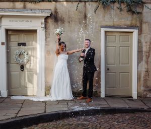 non-traditional wedding photographer Champagne   spray