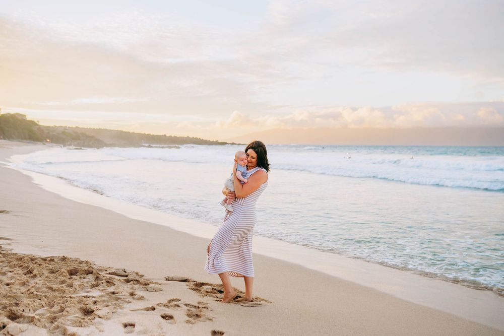 A series of beach wedding photos showing romantic moments along a sandy shoreline at sunset with ocean waves in the background.