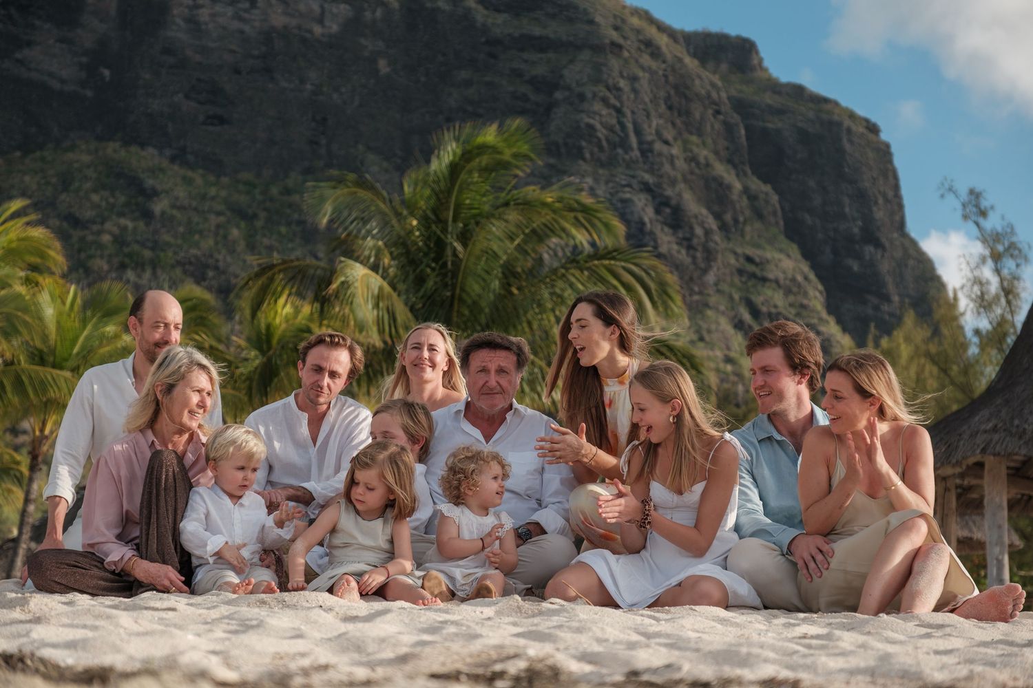 Family group photo session with mountain backdrop in Hawaii.